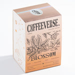 Blossom Naturals coffee packaging with floral design and artisanal details.