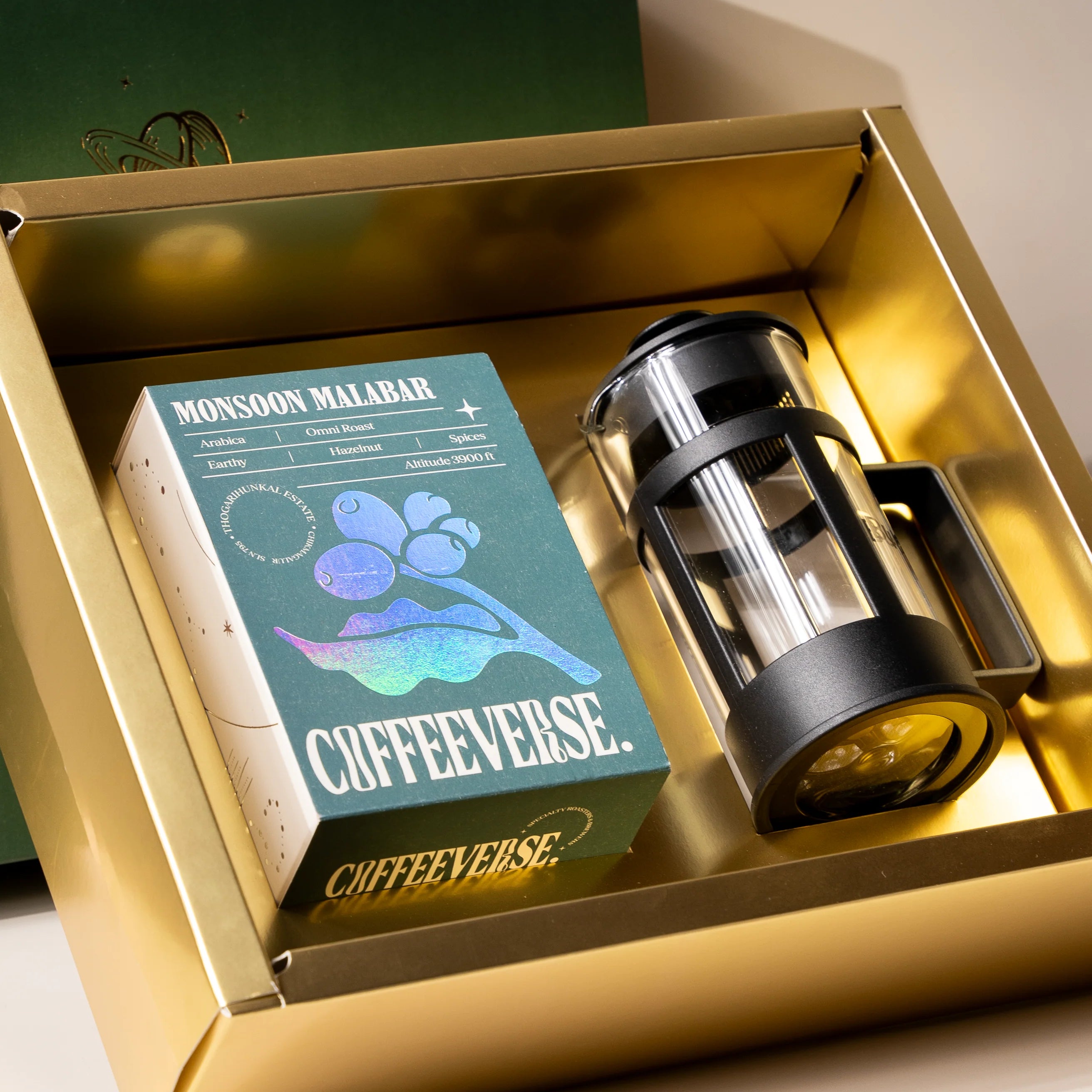 Coffeeverse product with packaging in a gold box