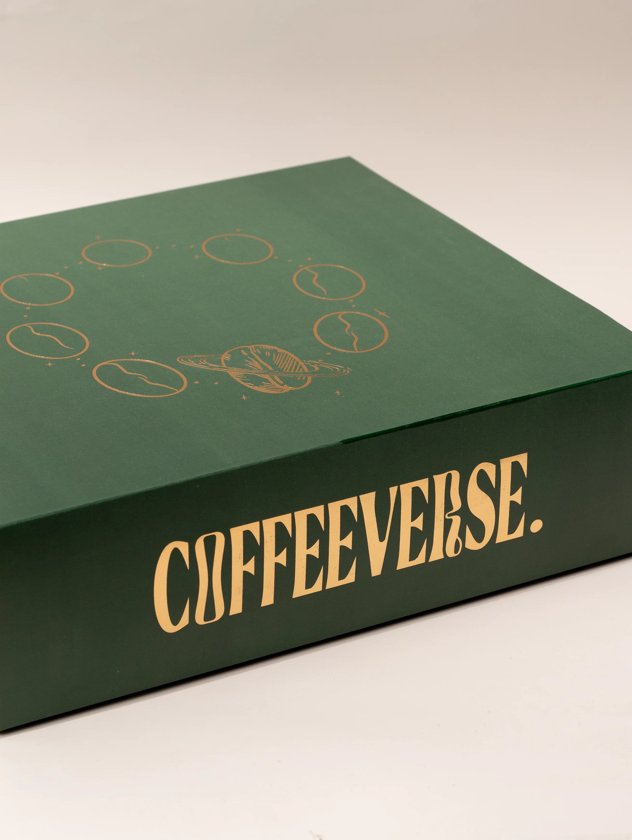 Green box with 'COFFEEVERSE' branding on a beige background
