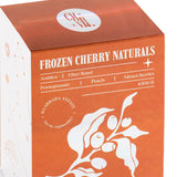 Coffee box labeled 'Frozen Cherry Naturals' with branding and product details on an orange background.