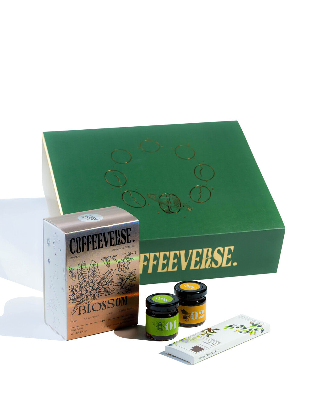 Coffeeeverse product set including a green box, packaging, and two jars on a white background
