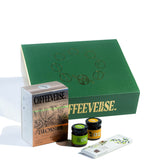Coffeeeverse product set including a green box, packaging, and two jars on a white background